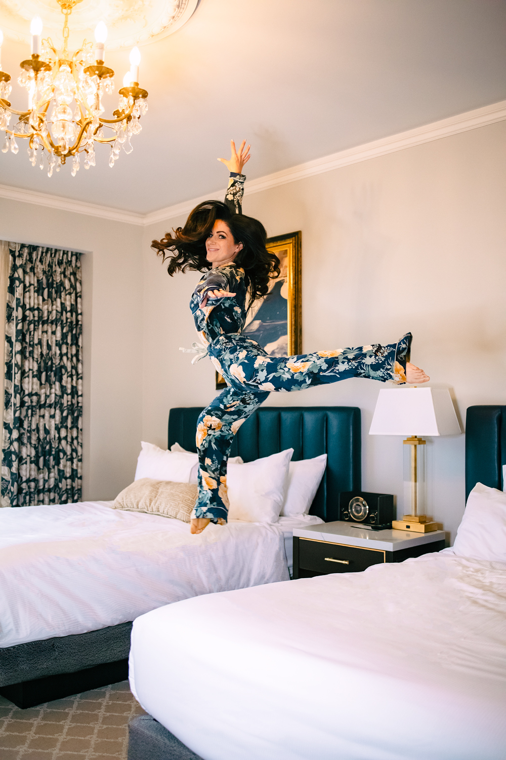 leaping over bed in pajamas